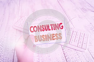 Text sign showing Consulting Business. Conceptual photo Consultancy Firm Experts give Professional Advice man holding colorful