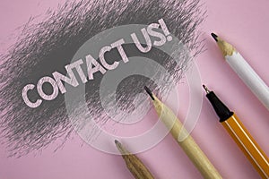 Text sign showing Contact Us Motivational Call. Conceptual photo Reaching us will make your dreams into reality written on Pink ba