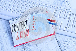 Text sign showing Content Is King. Conceptual photo marketing focused growing visibility non paid search results notebook paper