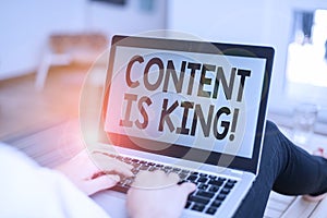 Text sign showing Content Is King. Conceptual photo marketing focused growing visibility non paid search results woman laptop