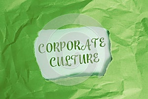 Text sign showing Corporate Culture. Conceptual photo pervasive values and attitudes that characterize a company Green crumpled