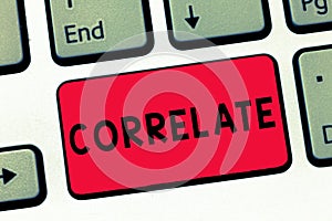 Text sign showing Correlate. Conceptual photo have mutual relationship or connection in which one thing affects Keyboard