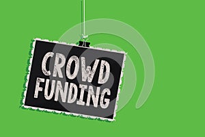 Text sign showing Crowd Funding. Conceptual photo Fundraising Kickstarter Startup Pledge Platform Donations Hanging blackboard mes