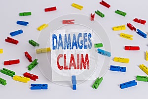 Text sign showing Damages Claim. Conceptual photo Deanalysisd Compensation Litigate Insurance File Suit Colored clothespin papers