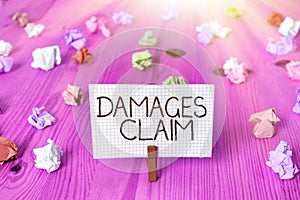 Text sign showing Damages Claim. Conceptual photo Demand Compensation Litigate Insurance File Suit photo