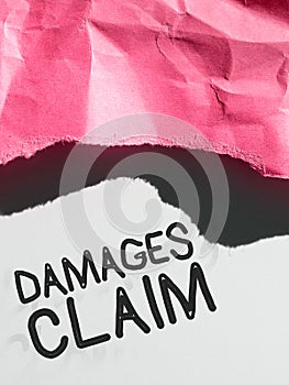Text sign showing Damages Claim. Word Written on Demand Compensation Litigate Insurance File Suit photo