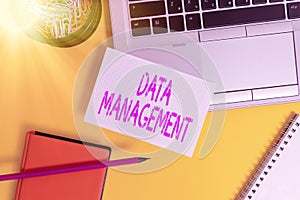 Text sign showing Data Management. Conceptual photo The practice of organizing and maintaining data processes Laptop pencil sheet