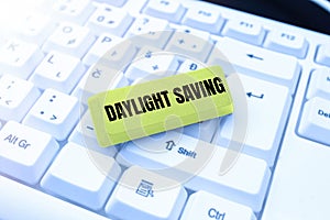 Text sign showing Daylight Saving. Conceptual photo Storage technologies that can be used to protect data Typing Cooking