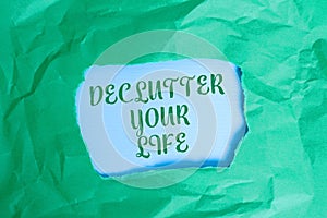 Text sign showing De Clutter Your Life. Conceptual photo remove unnecessary items from untidy or overcrowded places Green crumpled