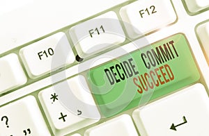 Text sign showing Decide Commit Succeed. Conceptual photo achieving goal comes in three steps Reach your dreams White pc