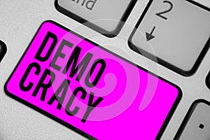 Text sign showing Demo Cracy. Conceptual photo freedom of the people to express their feelings and beliefs Keyboard purple key Int