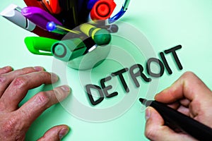 Text sign showing Detroit. Conceptual photo City in the United States of America Capital of Michigan Motown Man holding black mark