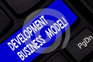 Text sign showing Development Business Model. Conceptual photo rationale of how an organization created Keyboard key photo