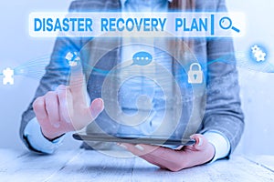 Text sign showing Disaster Recovery Plan. Conceptual photo having backup measures against dangerous situation Female