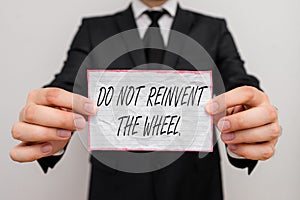 Text sign showing Do Not Reinvent The Wheel. Conceptual photo stop duplicating a basic method previously done.