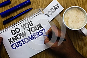 Text sign showing Do You Know Your Customers question. Conceptual photo having a great background about clients Man holding marker