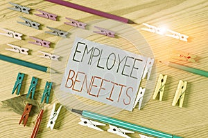Text sign showing Employee Benefits. Conceptual photo indirect and noncash compensation paid to an employee Colored clothespin photo
