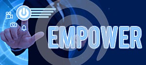 Text sign showing Empower. Conceptual photo to give power or authority to authorize especially by legal