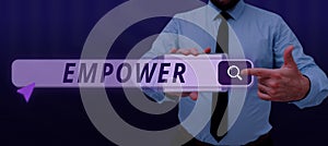 Text sign showing Empower. Internet Concept to give power or authority to authorize especially by legal
