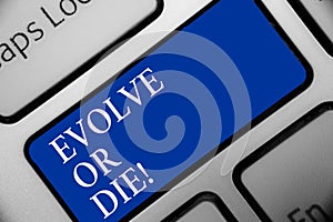 Text sign showing Evolve Or Die. Conceptual photo Necessity of change grow adapt to continue living Survival Keyboard blue key Int