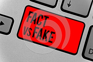 Text sign showing Fact Vs Fake. Conceptual photo Rivalry or products or information originaly made or imitation Keyboard red key I photo