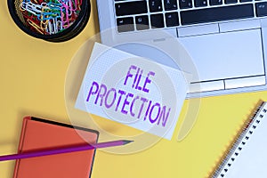 Text sign showing File Protection. Conceptual photo Preventing accidental erasing of data using storage medium Laptop pencil sheet photo