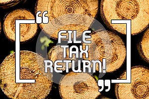 Text sign showing File Tax Return. Conceptual photo Paperwork to get financial money returning accountant job Wooden