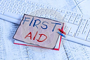 Text sign showing First Aid. Conceptual photo Practise of healing small cuts that no need for medical training notebook