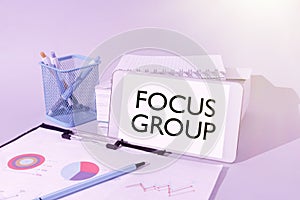 Text sign showing Focus Group. Business approach showing assembled to participate in discussion about something