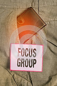 Text sign showing Focus Group. Conceptual photo showing assembled to participate in discussion about something Small little wallet