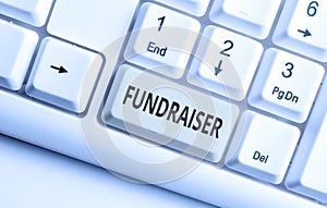Text sign showing Fundraiser. Conceptual photo demonstrating whose job or task is seek financial support for charity photo