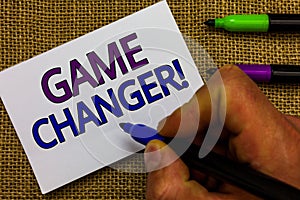 Text sign showing Game Changer. Conceptual photo Sports Data Scorekeeper Gamestreams Live Scores Team Admins Man hand holding mark