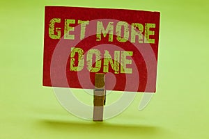 Text sign showing Get More Done. Conceptual photo Checklist Organized Time Management Start Hardwork Act Clothespin holding red pa