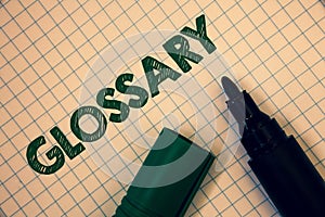 Text sign showing Glossary. Conceptual photo Alphabetical list of terms with meanings Vocabulary Descriptions Squared paper open m