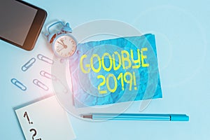 Text sign showing Goodbye 2019. Conceptual photo express good wishes when parting or at the end of last year Alarm clock