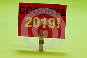 Text sign showing Goodbye 2019. Conceptual photo New Year Eve Milestone Last Month Celebration Transition Clothespin