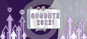 Text sign showing Goodbye 2022. Concept meaning New Year Eve Milestone Last Month Celebration Transition Woman Showing photo