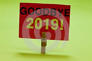 Text sign showing Goodbye 2019. Conceptual photo New Year Eve Milestone Last Month Celebration Transition Clothespin photo