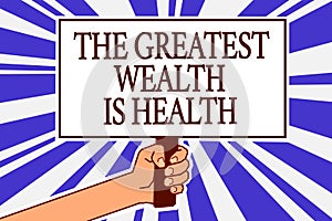 Text sign showing The Greatest Wealth Is Health. Conceptual photo being in good health is the prize Take care Man hand holding pos