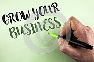 Text sign showing Grow Your Business. Conceptual photo improve your work enlarge company overcome competitors written by Man holdi