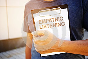 Text sign showing hand writing words Empathic Listening