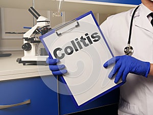 Text sign showing hand written words Colitis