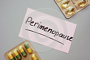 Text sign showing hand written words Perimenopause photo