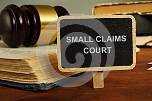 Text sign showing hand written words small claims court photo