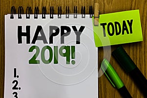 Text sign showing Happy 2019. Conceptual photo time or day at which a new calendar year begin from now Notebook clothespin holding