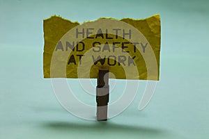 Text sign showing Health And Safety At Work. Conceptual photo Secure procedures prevent accidents avoid danger Paperclip hold torn