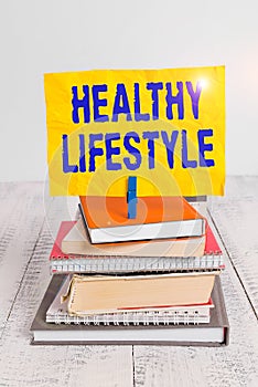 Text sign showing Healthy Lifestyle. Conceptual photo way of living that lowers the risk of being seriously ill pile stacked books