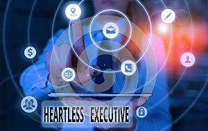 Text sign showing Heartless Executive. Conceptual photo workmate showing a lack of empathy or compassion. photo