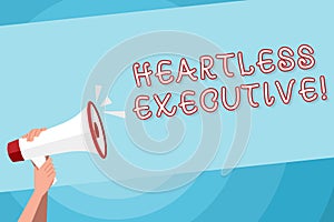 Text sign showing Heartless Executive. Conceptual photo workmate showing a lack of empathy or compassion Human Hand