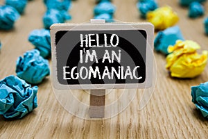 Text sign showing Hello I am An Egomaniac. Conceptual photo Selfish Egocentric Narcissist Self-centered Ego Paperclip hold written photo